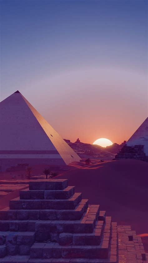 The Sun Is Setting Behind Two Pyramids In An Arid Area With Steps