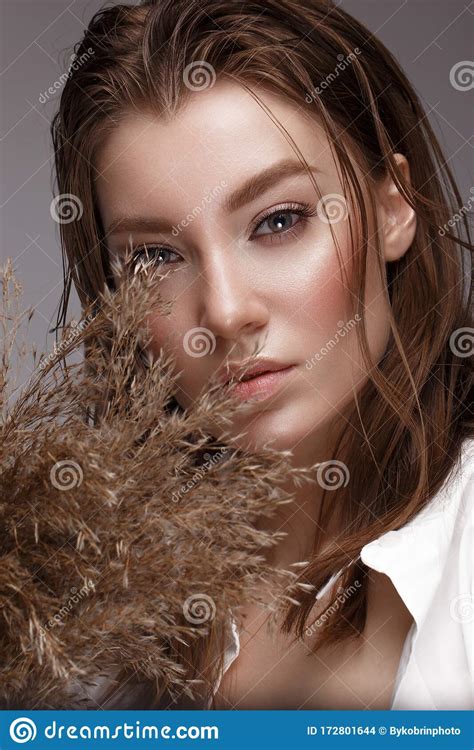 Beautiful Woman With Classic Nude Make Up Light Hairstyle And Dry