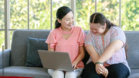 Asian Young Chubby Down Syndrome Autistic Daughter Learning Mathematic