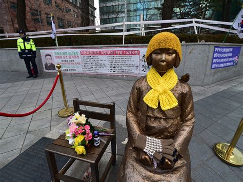 comfort woman memorial statues a thorn in japan s side now sit on korean buses mpr news