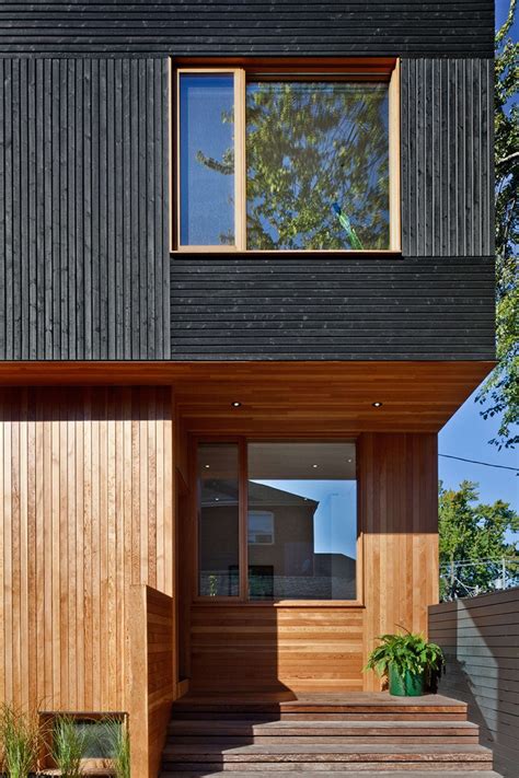 black siding  natural wood accents   toronto home contemporist