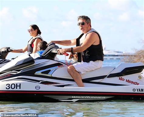shirtless simon cowell tops up his tan in barbados during holiday with lauren silverman and son