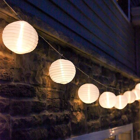 paper lantern string lights combined kitchen  living room interior