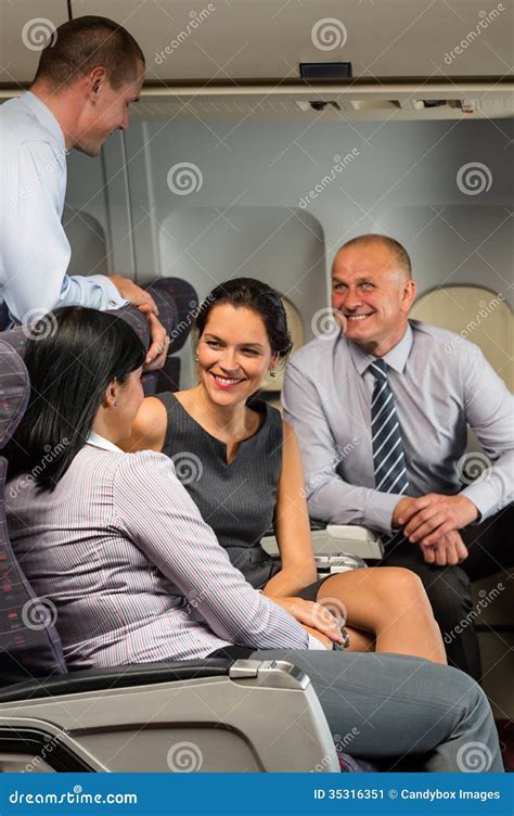 business people passengers flying airplane talking stock image image  people plane