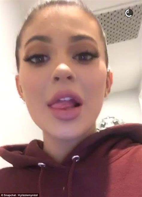 bored kylie jenner licks her lips puckers her mouth and mimics