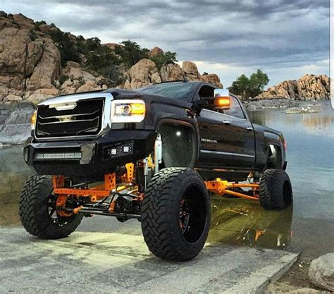 jacked  trucks mudding jackeduptrucks lifted chevy tahoe jacked