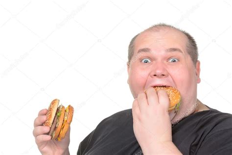 fat man greedily eating hamburger stock photo  discovod