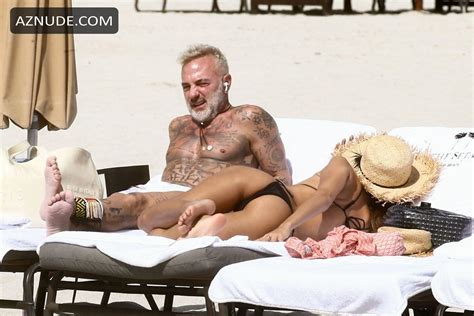 gianluca vacchi is exuding serious sex appeal while out in white trunks