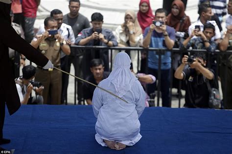 Indonesian Woman Collapses In Pain As She Is Flogged For Showing