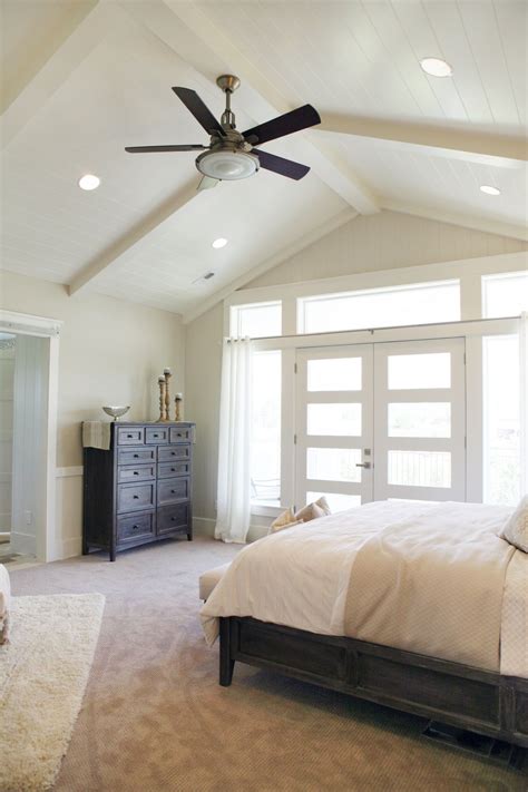 master bedroom high ceiling bright windows   fan