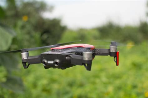 red drone hovering   air stock image image  illustrative innovation