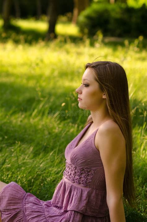 Beautiful Woman Sitting On The Meadow Stock Image Image Of Beautiful
