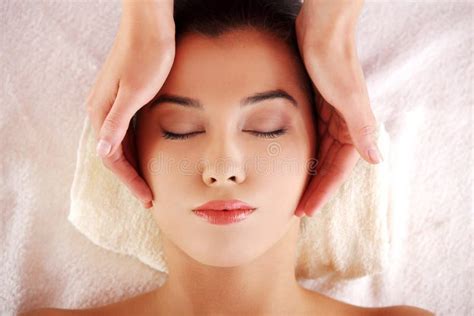 woman enjoy receiving face massage  spa saloon stock photo image