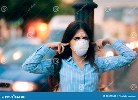 girl  mask covering  ears   noise pollution stock photo image  dust