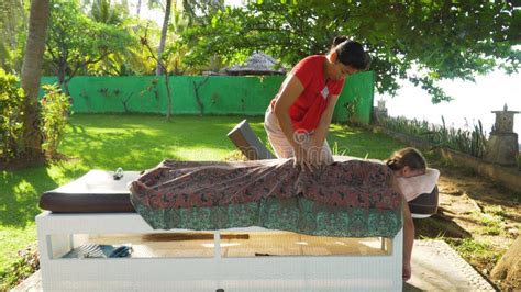 Woman Doing Massage To Girl In Asia Bali Indonesia Stock Image