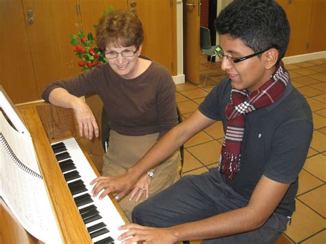 Lds Missionary Couple In The Madrid Spain Temple Teaching Piano Lessons