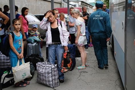 thousands of ukrainian refugees flee to russia for an uncertain future