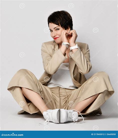 Smiling Beautiful Short Haired Brunette Woman In Beige Business Smart