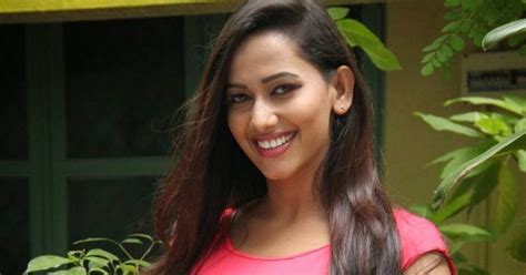 sanjana singh hot photos in short dress at meagamann movie