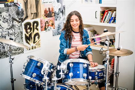 teenage girl playing drums stock image c035 3802 science photo