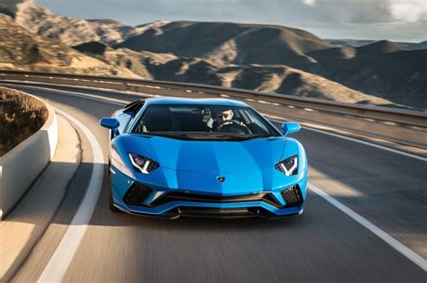 blue sports car driving   road