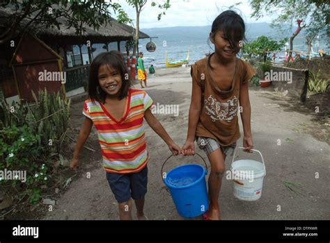 Girls Carrying Water Taal Volcano Luzon Philippines Asia Stock