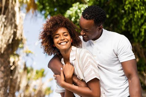 Outdoor Protrait Of African American Couple Embracing Each Other Stock