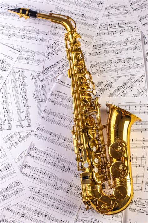 Saxophone Against A Background Of Sheet Music Stock Image Image Of
