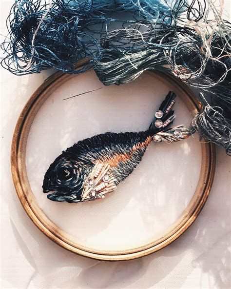 nature inspired embroidery designs appear to float on translucent tulle fabric