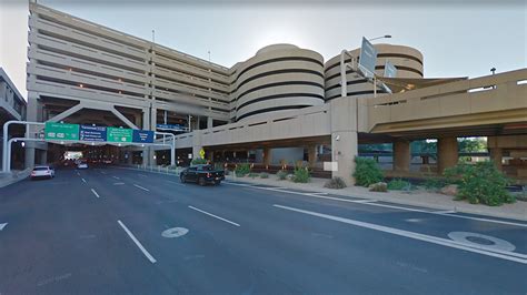 bomb scare  phoenix airport caused  unattended car driver    parking ticket
