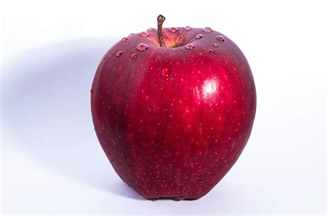 Selective Focus Photo Of Delicious Red Apple Fruit With White
