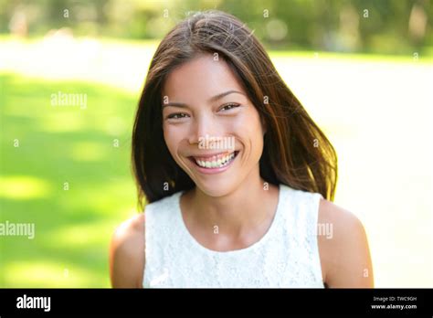 asian girl woman portrait in park smiling happy mixed race asian