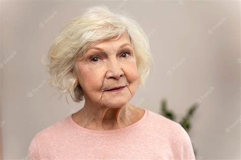 premium photo smiling confident grandmother posing at home old senior