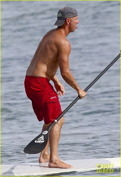 kenny chesney hits the waves for paddleboarding session photo 3490800
