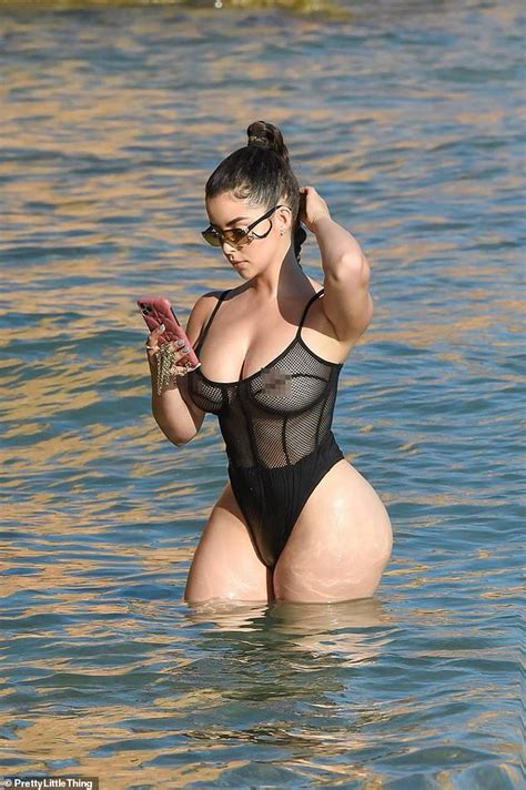 demi rose flaunts her jaw dropping curves in a mesh thong