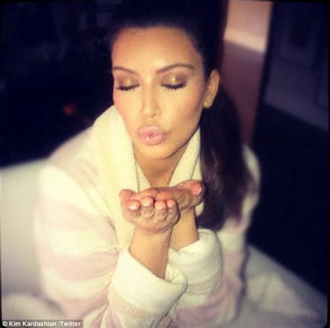 kim kardashian shows off her perfect pout as she puckers up for her