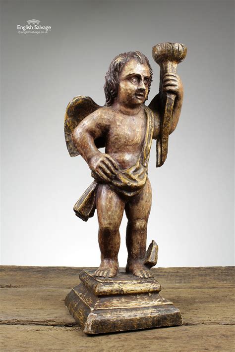 antique  century carved cherub statue