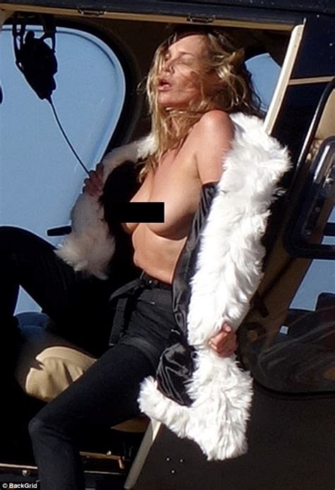 topless kate moss fearlessly dangles out of helicopter