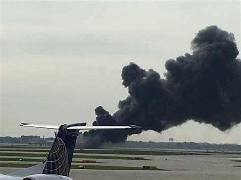 chicago ohare american airlines  catches fire  runway east