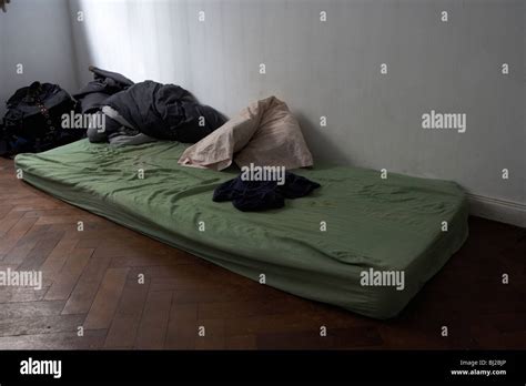 dirty mattress lying   floor   bedroom   stock