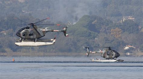 italian air force nh es  floats carry  training activity  lake bracciano