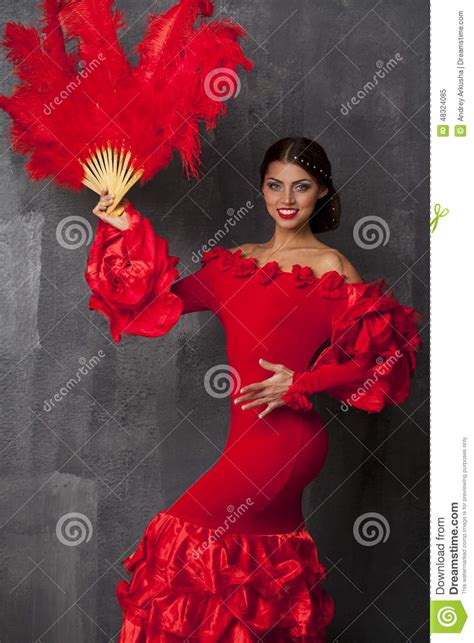 woman traditional spanish flamenco dancer dancing in a red dress stock