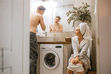 Young Caucasian Couple Spend Morning In Toilet Together Every Day Life