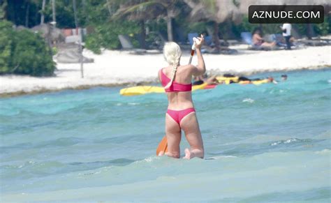 lindsey vonn sexy seen in a red bikini as she takes paddle board for a