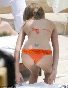 millie mackintosh shows off her slim figure in a skimpy orange bikini