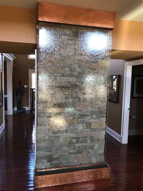 residential stone wall  glass water wall   indoor waterfall