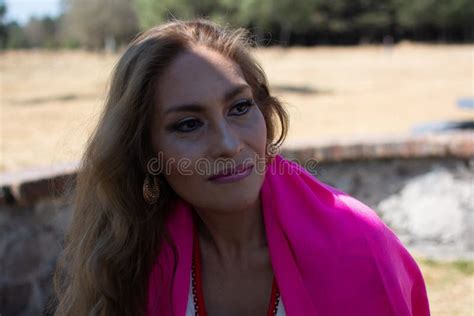 Mature Woman Enjoys A Sunny Day In A Park With Traditional Mexican