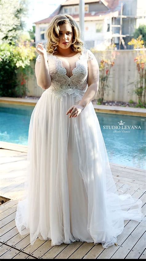 romantic bohemian plus size wedding dress with deep v