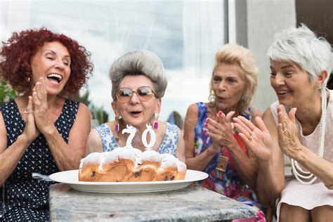 playful happy seniors women  fun  birthday party  stocksy contributor beatrix boros