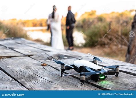 drone standing   table  wedding couple  nature stock photo image  controlled